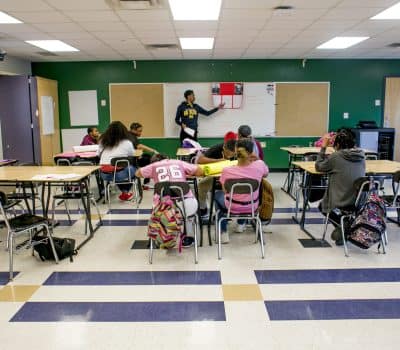 A teacher instructs students in an English class at Southeastern High School in Detroit, MI. Photo by Anthony Lanzilote/Chalkbeat ÑJune, 2019 photoÑ